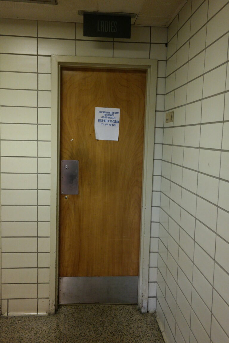 Ladies room sign over bathroom door